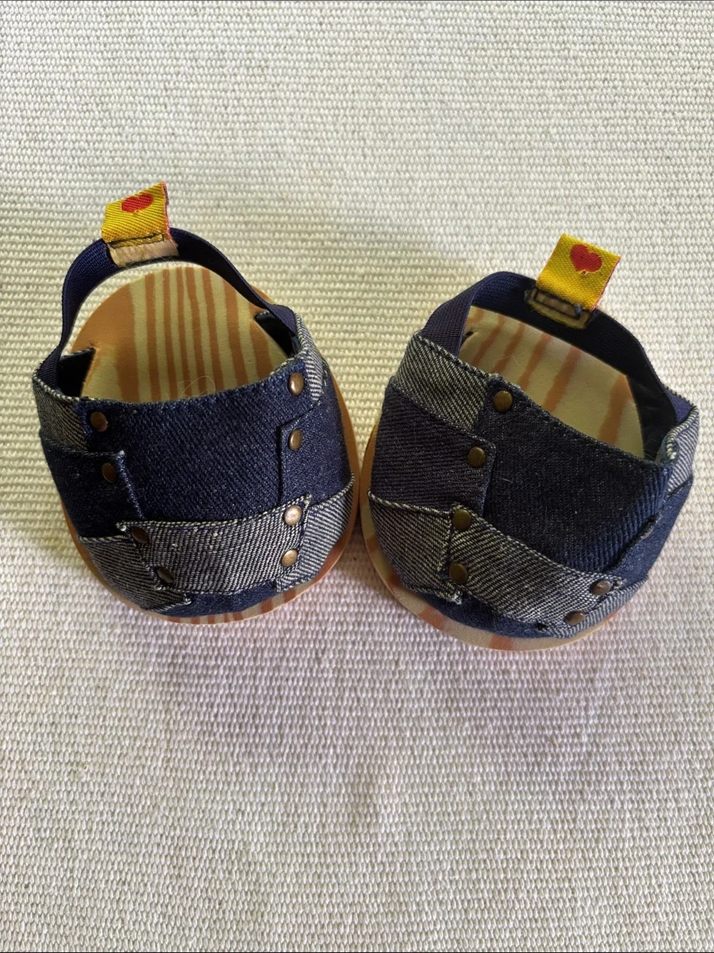 Build-A-Bear Workshop denim patchwork sandals featuring studs & faux wood soles.